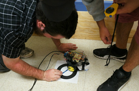 Students working on a small robot
